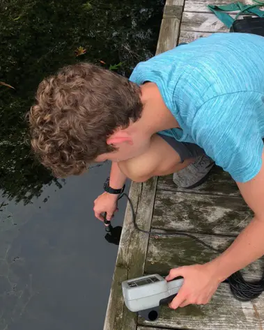 student using a meter in the water