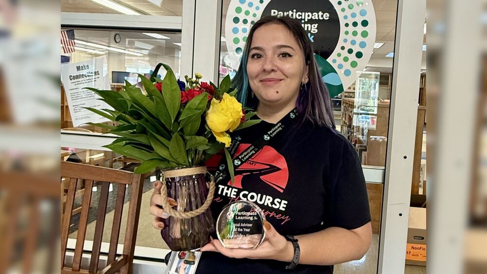teacher holding flowers