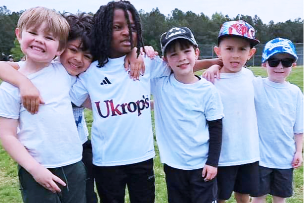 six students pose for a photo