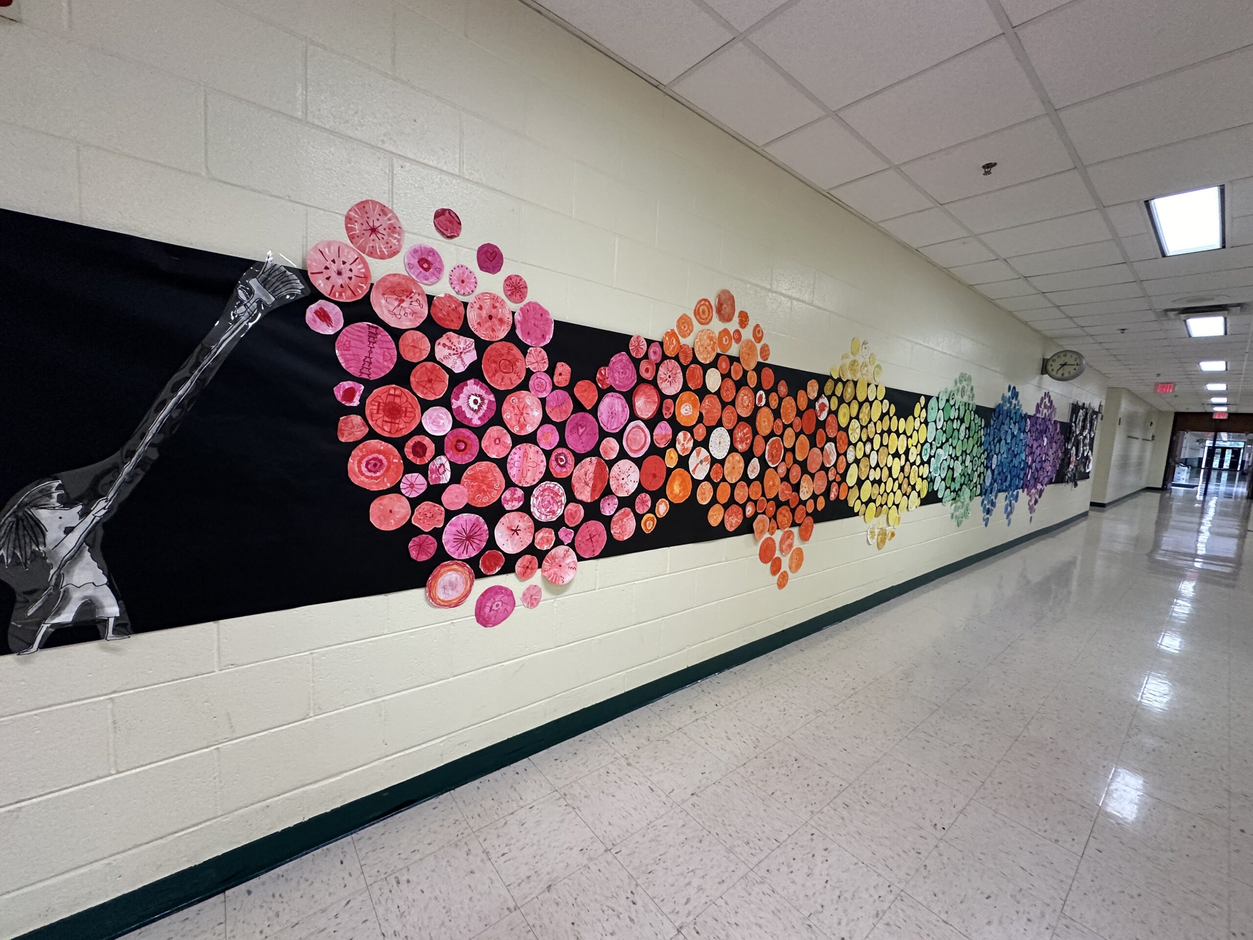 mural of dots in school hallway