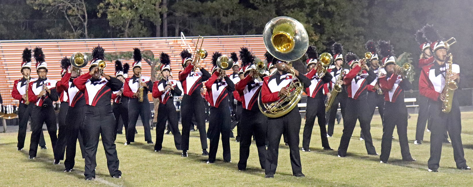 marching band performing on football field