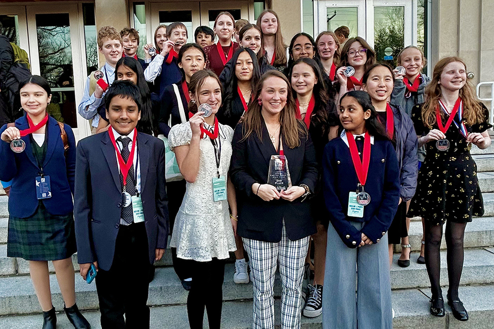 Students pose with their medals