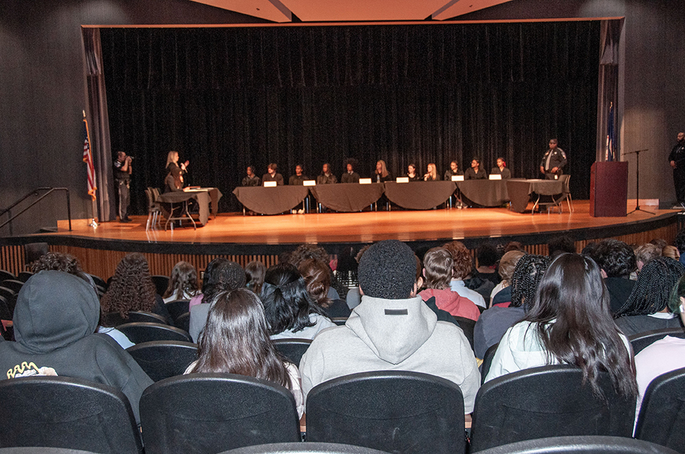 students on stage during event
