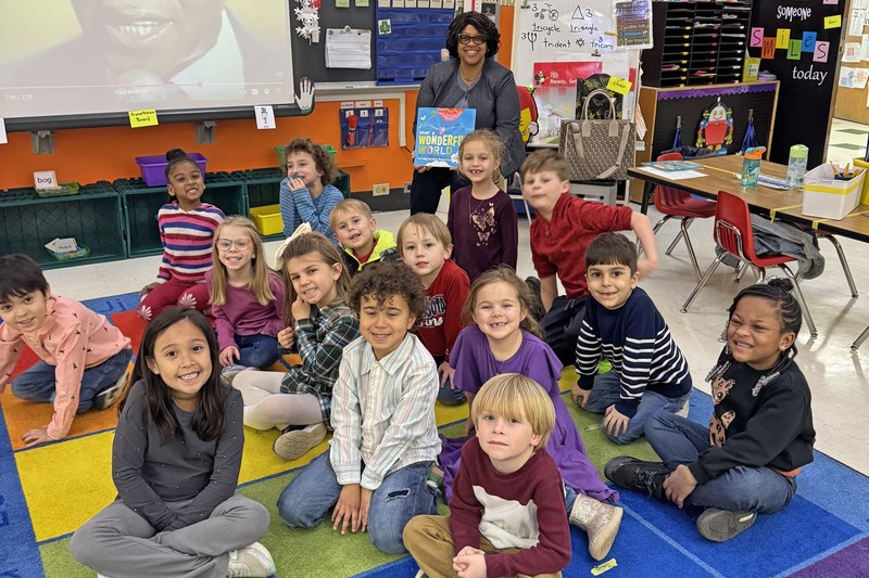 Dr. Lisa High posing with students