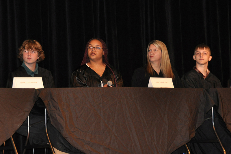 students on stage during event