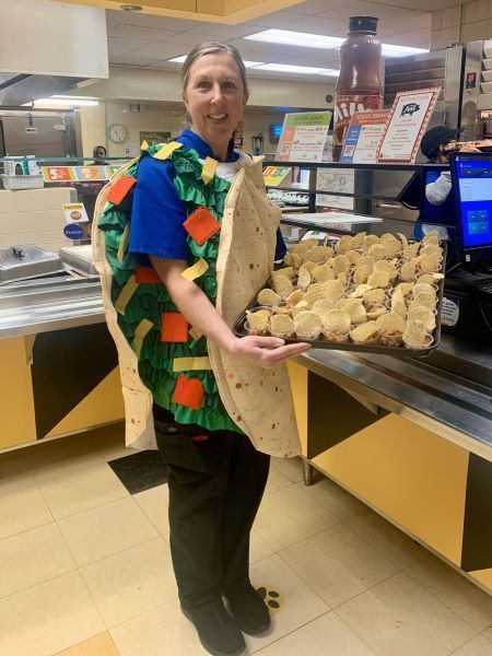person holding tacos
