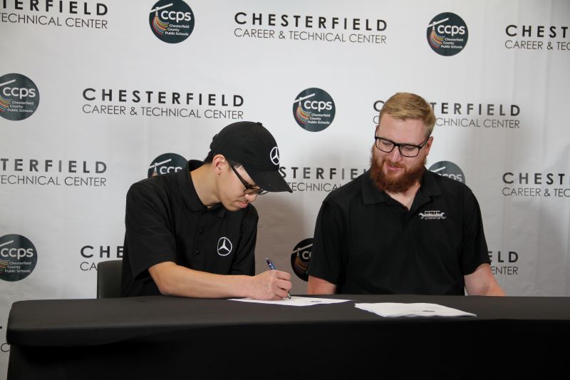 Student signing