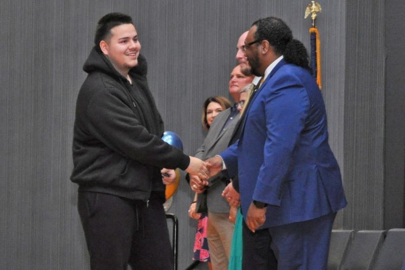 Student shaking hands