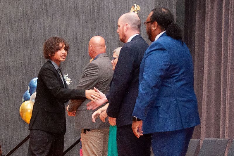 Student shaking hands