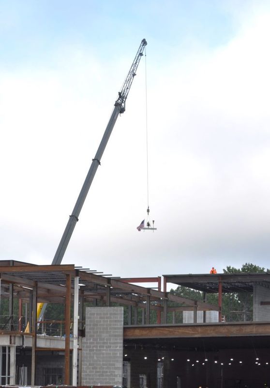 A large crane placing a beam