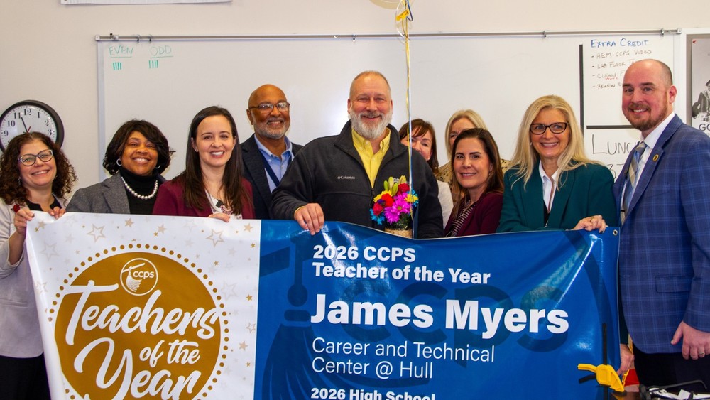 James Myers accepting his award with a large group