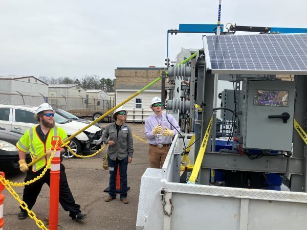 Dominion Energy workers demonstrating equipment