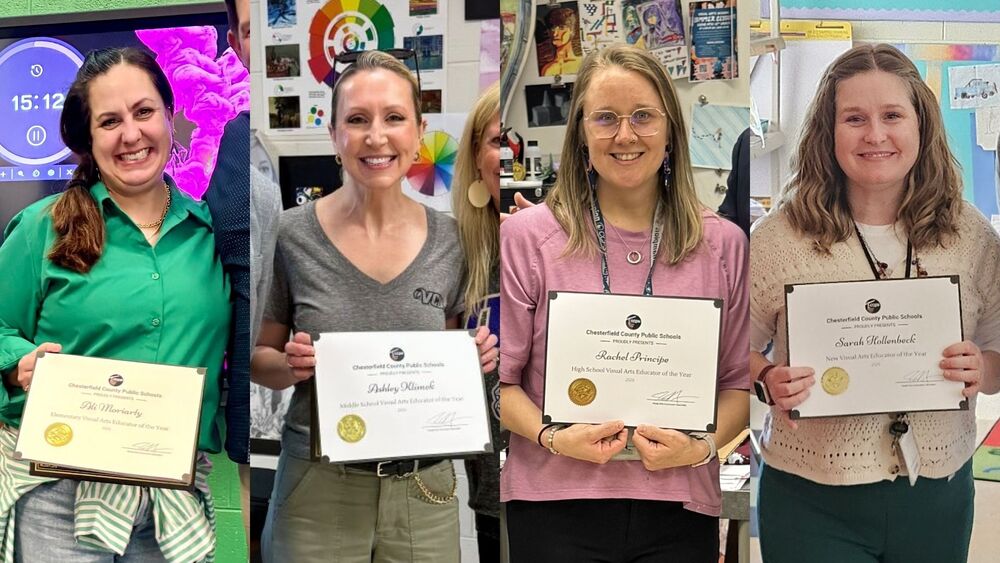 Teachers smiling and holding their awards