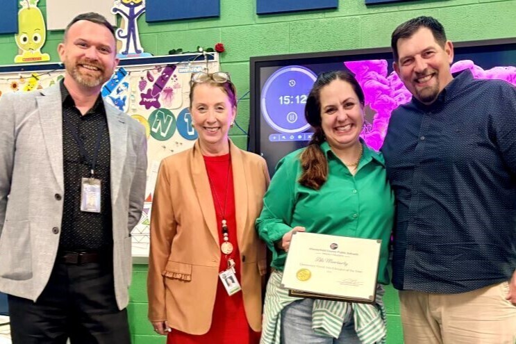 Teacher receiving thei award