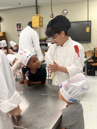 Students talking in a kitchen