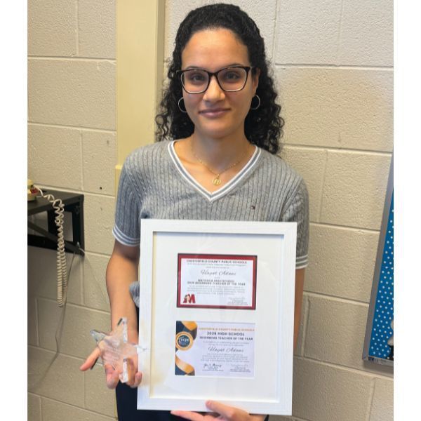 Hayat Adawi holding an award