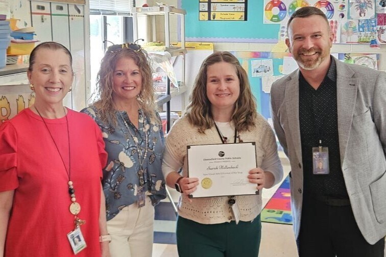 Teacher receiving thei award