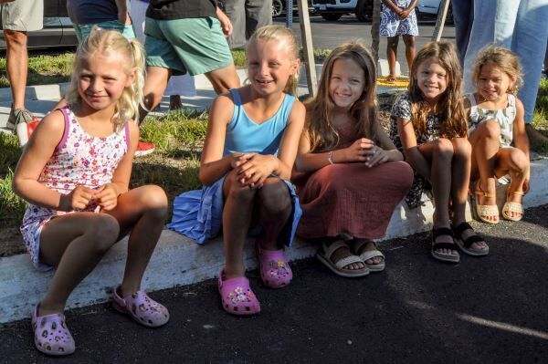 Girls sitting down and smiling