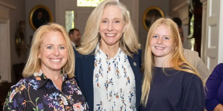 Teachers pose with Governor