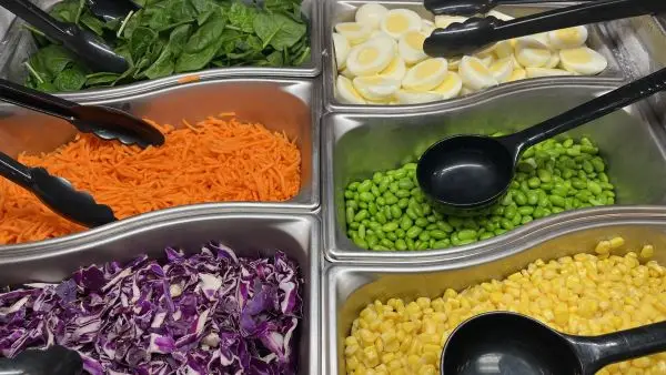 Salad bar with spinach, eggs, carrots, edamame. Salad bar with spinach, eggs, carrots, edamame.